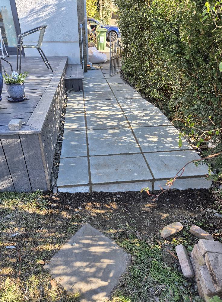 Decking boards laid diagonally, neat step detail at edge.