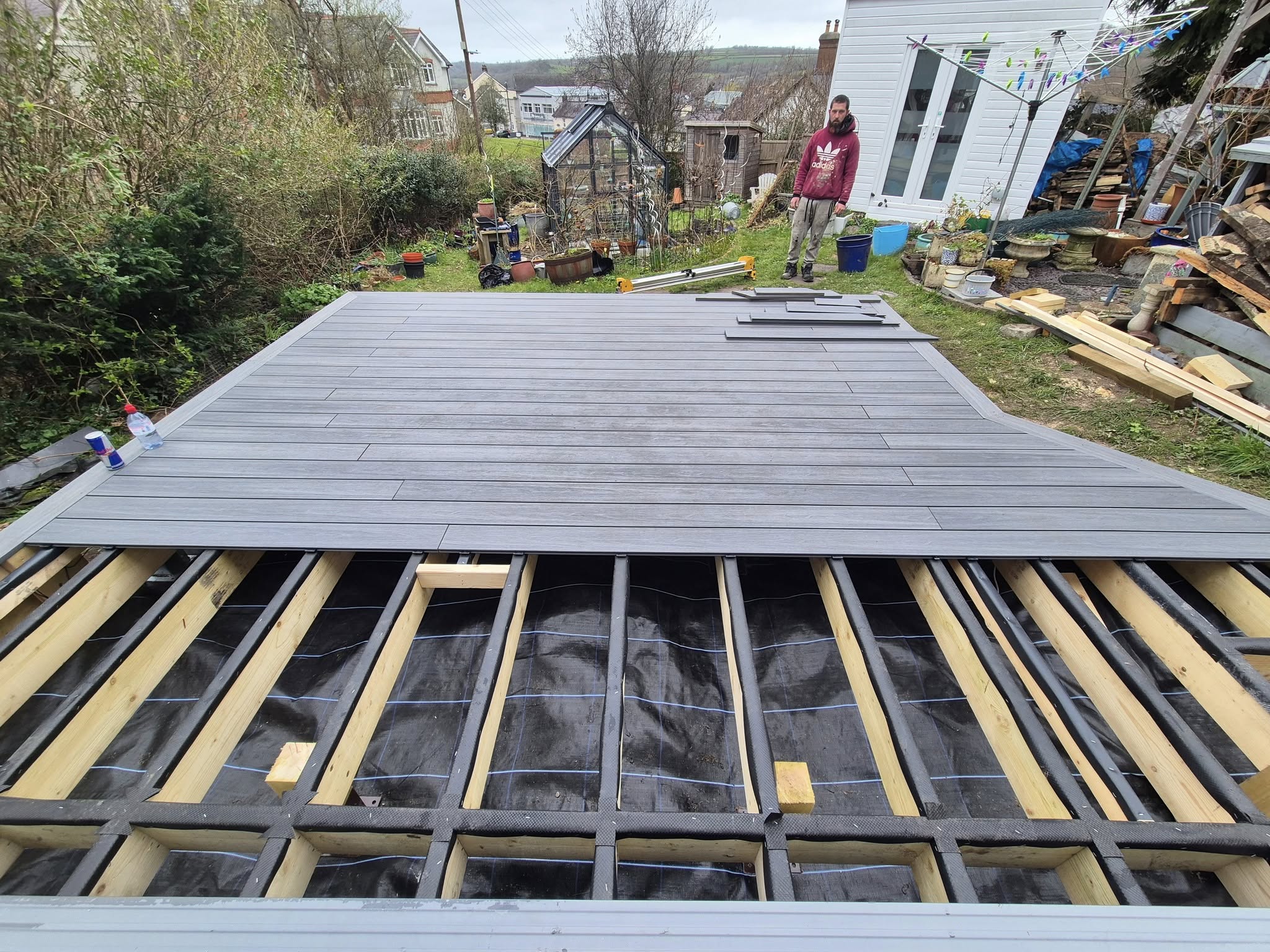 Garden decking almost complete, with only a few boards left to fit.