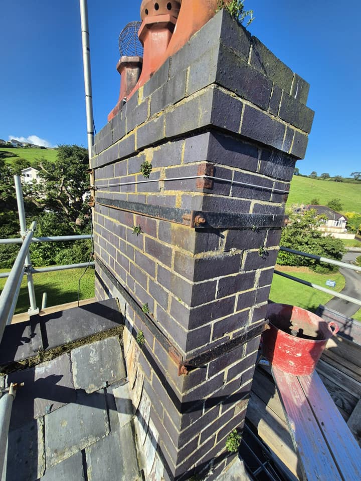 Close-up of a new brick chimney stack with sharp lines and clean pointing.