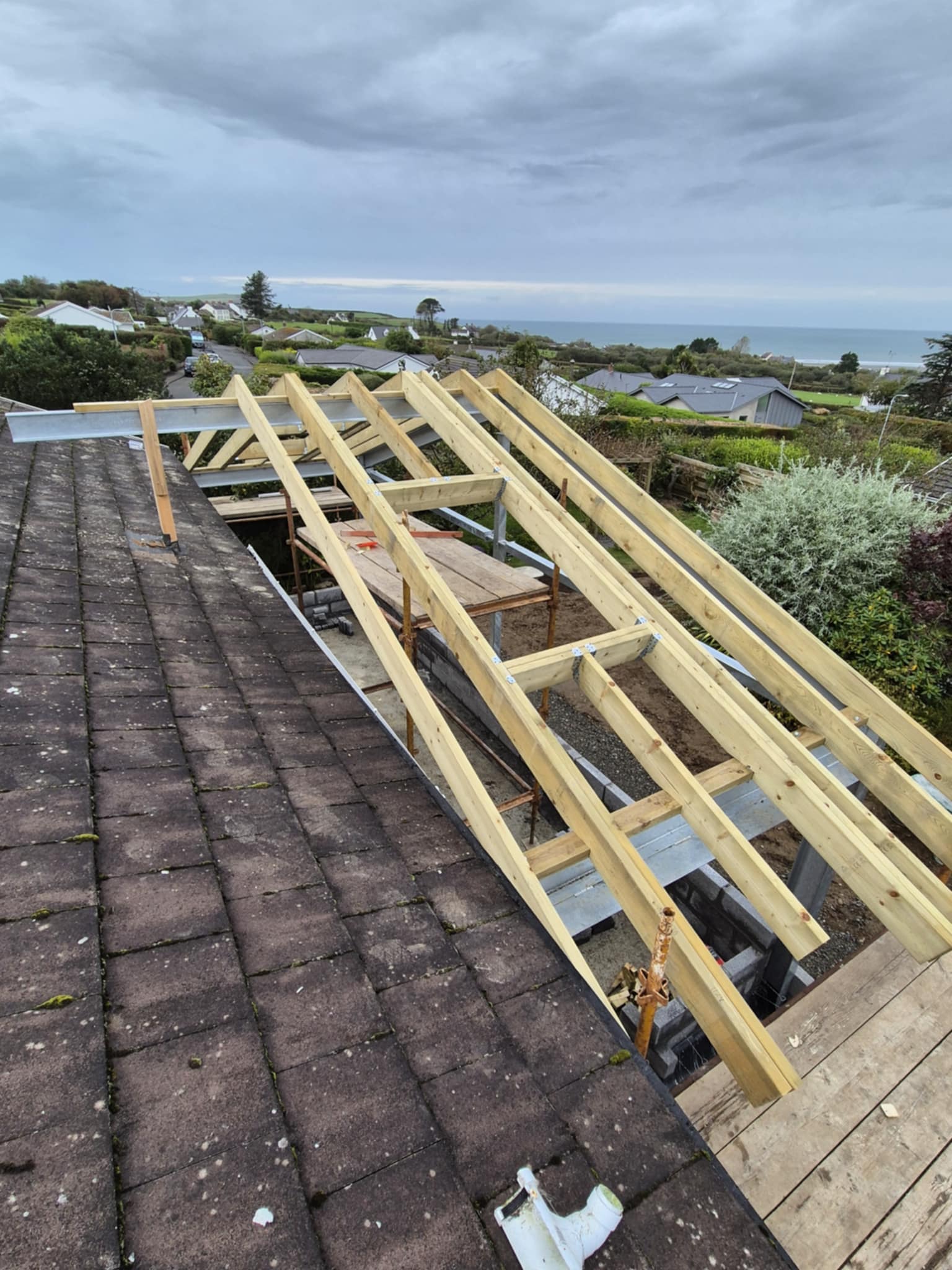 Timber roof structure under construction, view from the scaffolding.
