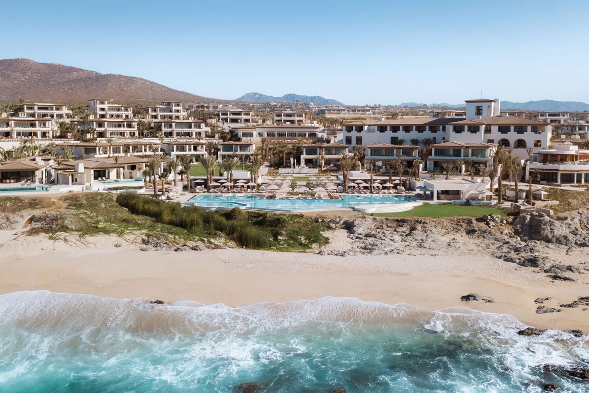 Aerial view of beachfront Four Seasons Cabo del Sol resort with oceanfront pools represented by Terentti
