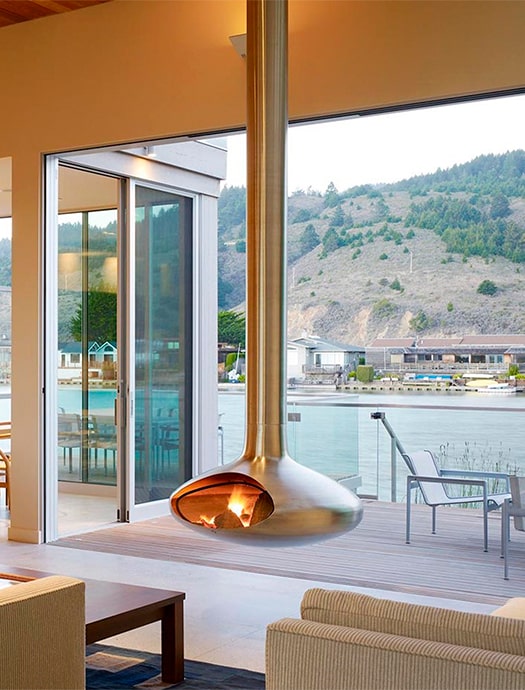 Fireorb hanging fireplace in brushed metal finish by Terentti at coastal home