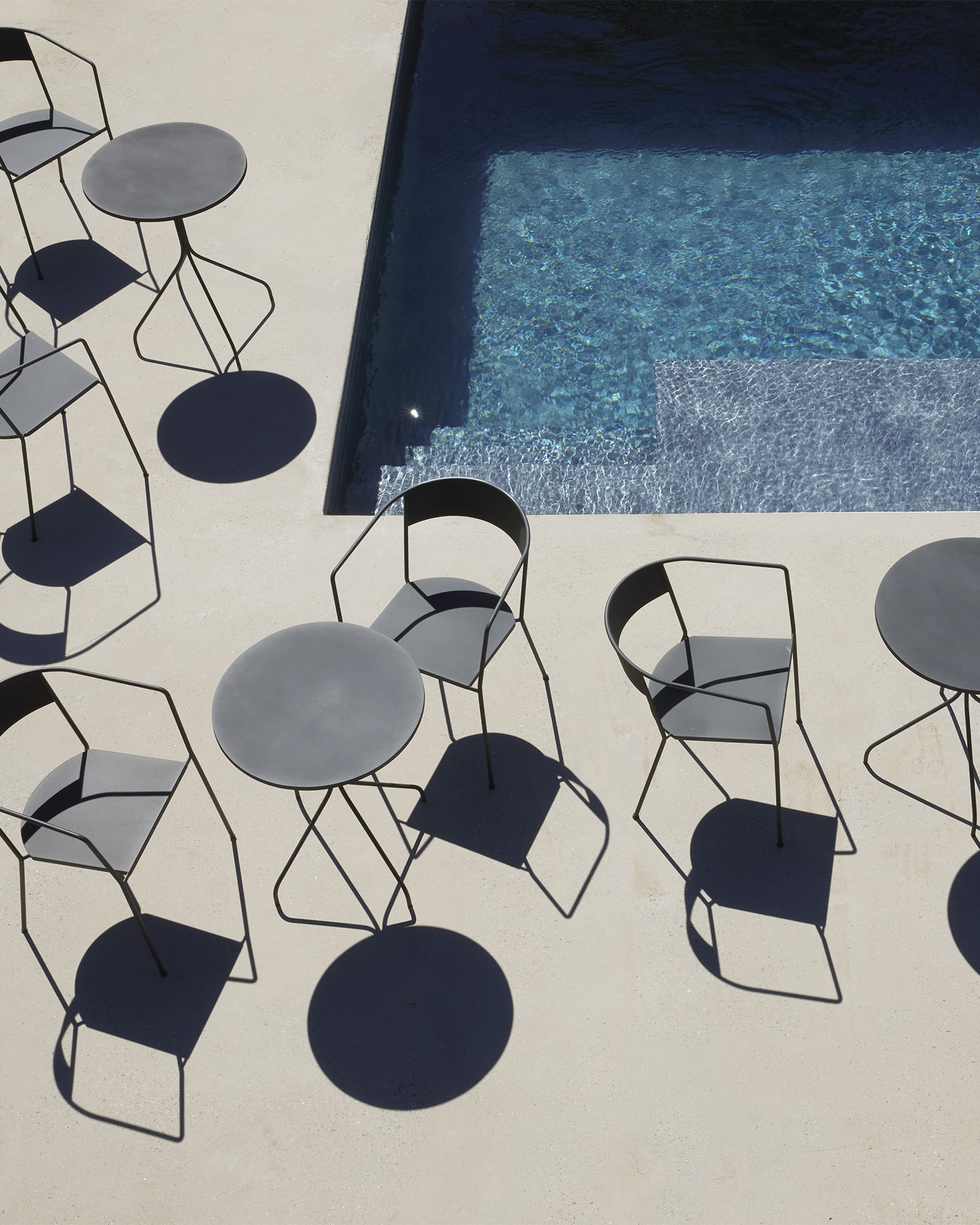 Skargaarden Arholma outdoor chairs and tables beside a pool in a luxury hospitality setting represented by Terentti