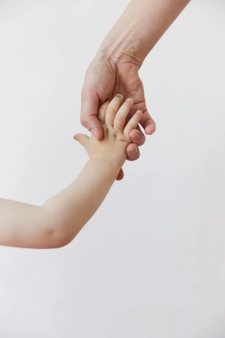 woman-and-child-holding-hands