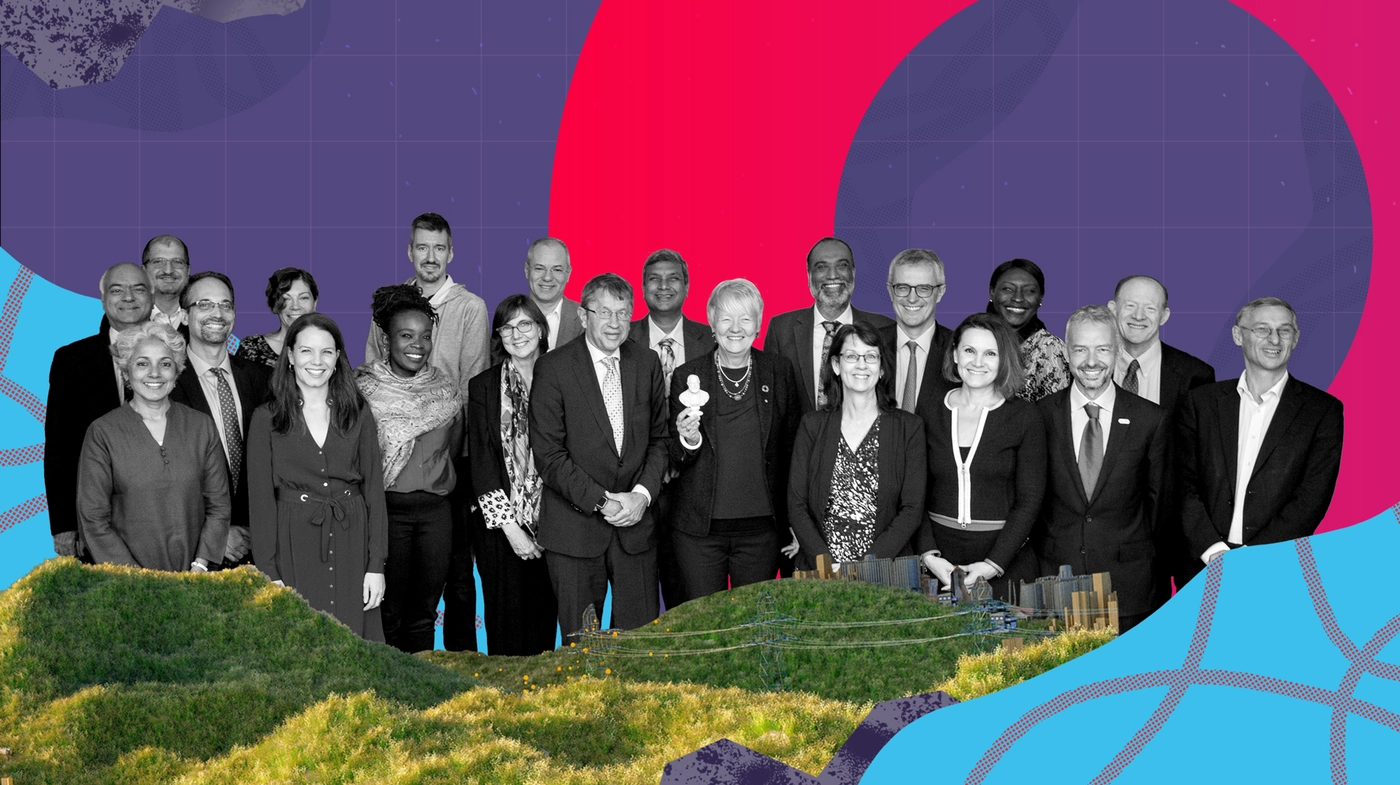 A diverse group of individuals, including men and women, posing together in front of a colorful, abstract background featuring geometric shapes and a landscape.