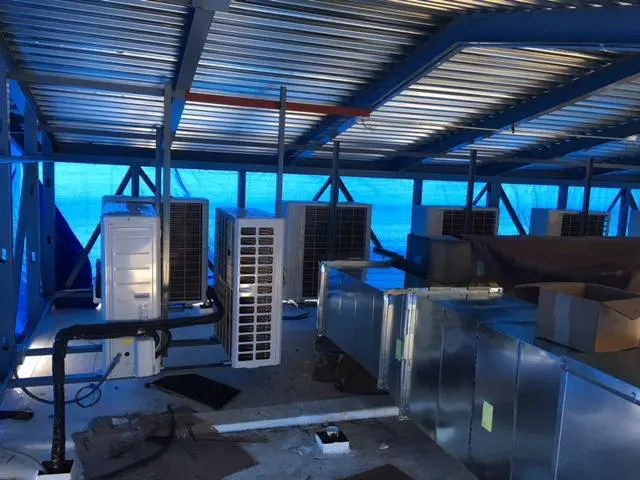 Indoor ductwork and ventilation units under installation at diner in CT