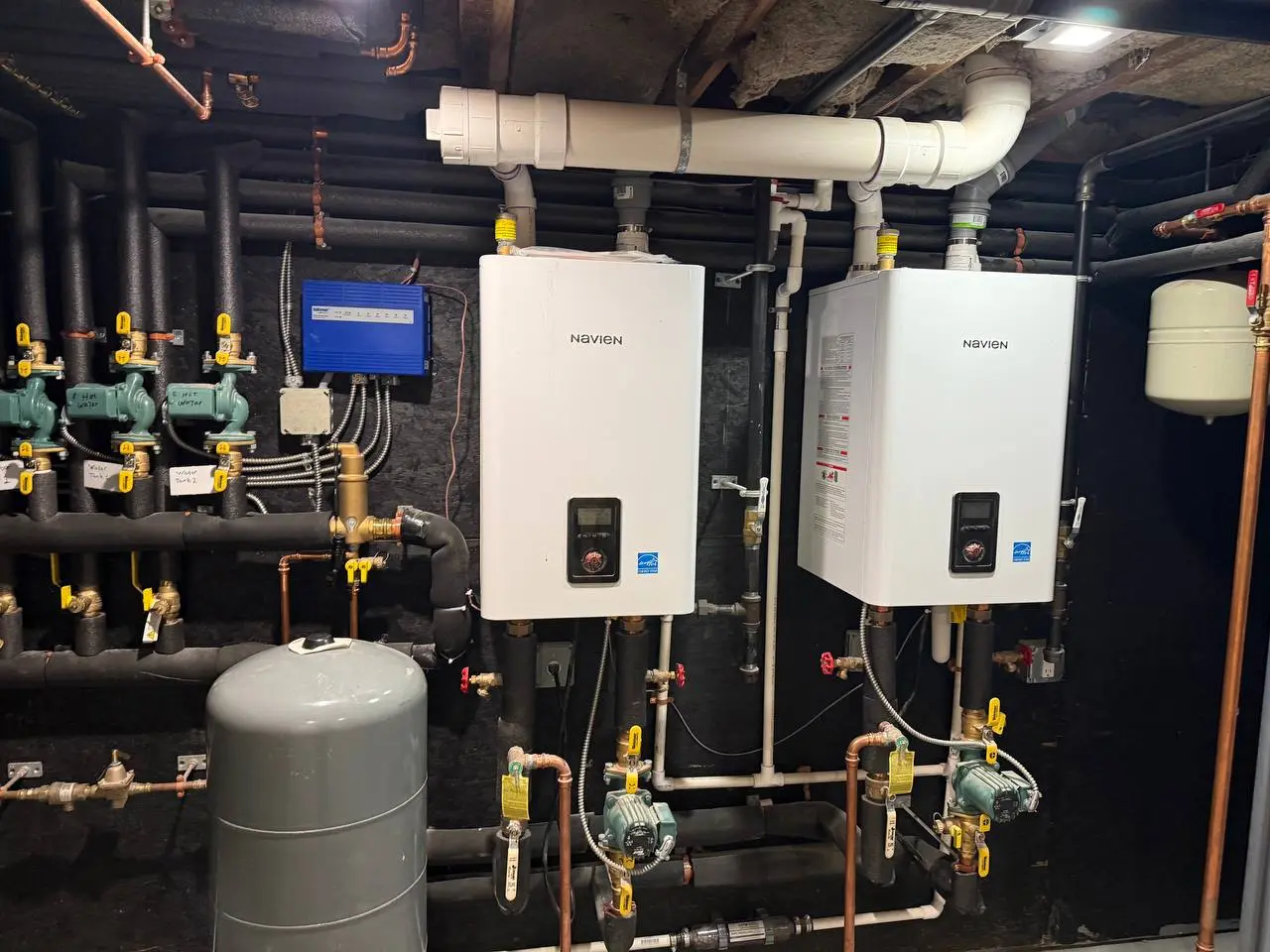 Dual Navien boiler system installed by Yukos Mechanical in a multi-unit residential property in Rye, NY