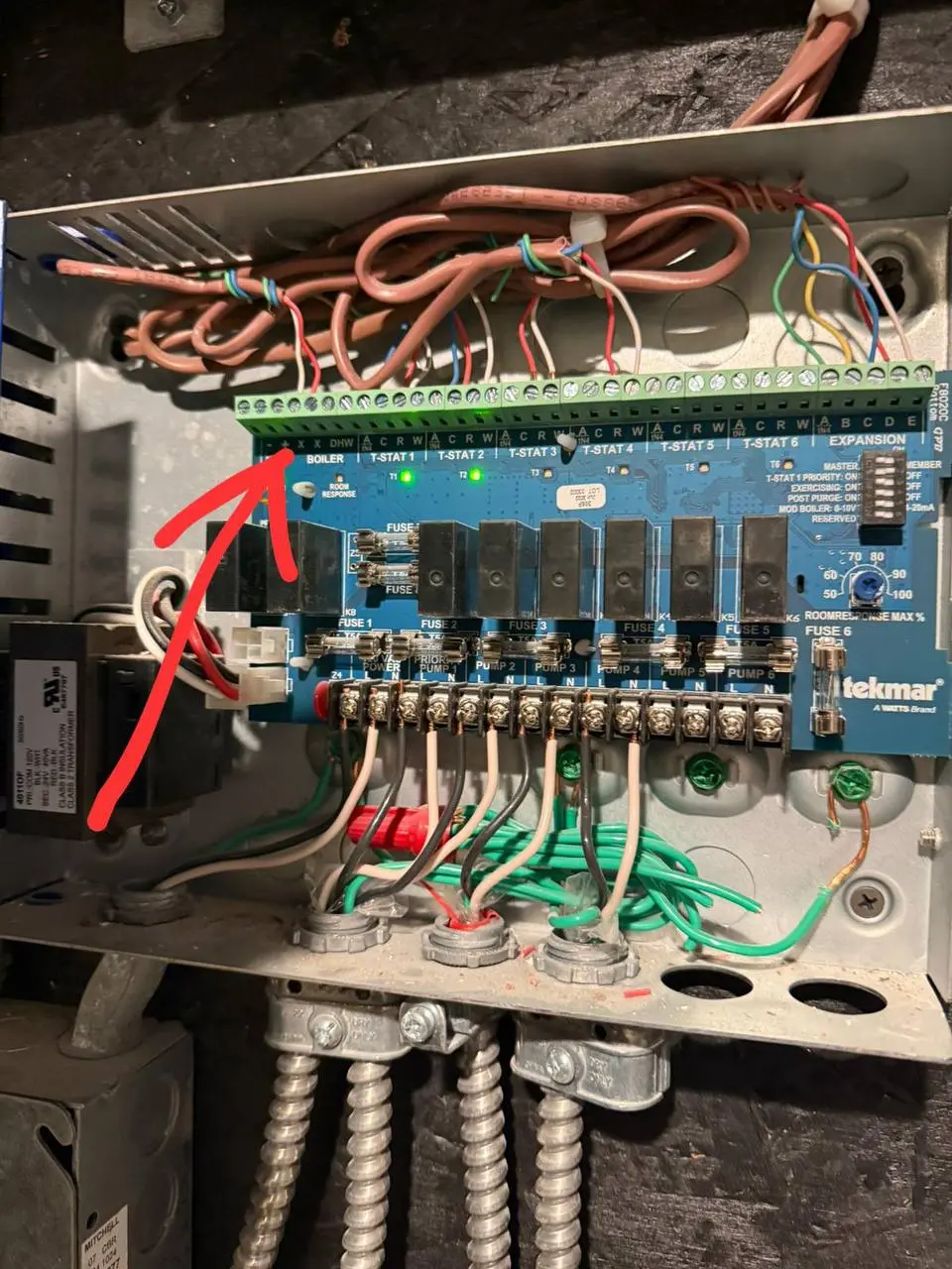 Control panel wiring for multi-zone boiler system in Rye, NY. Tekmar control board used for precise thermostat and pump management installed by Yukos Mechanical.