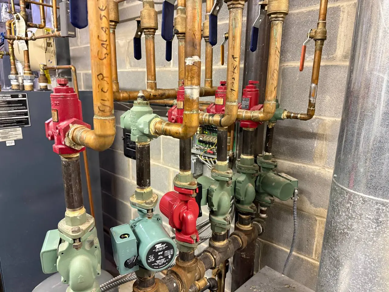 Taco multi-zone circulator relay control panel wiring inside residential boiler room Harrison NY