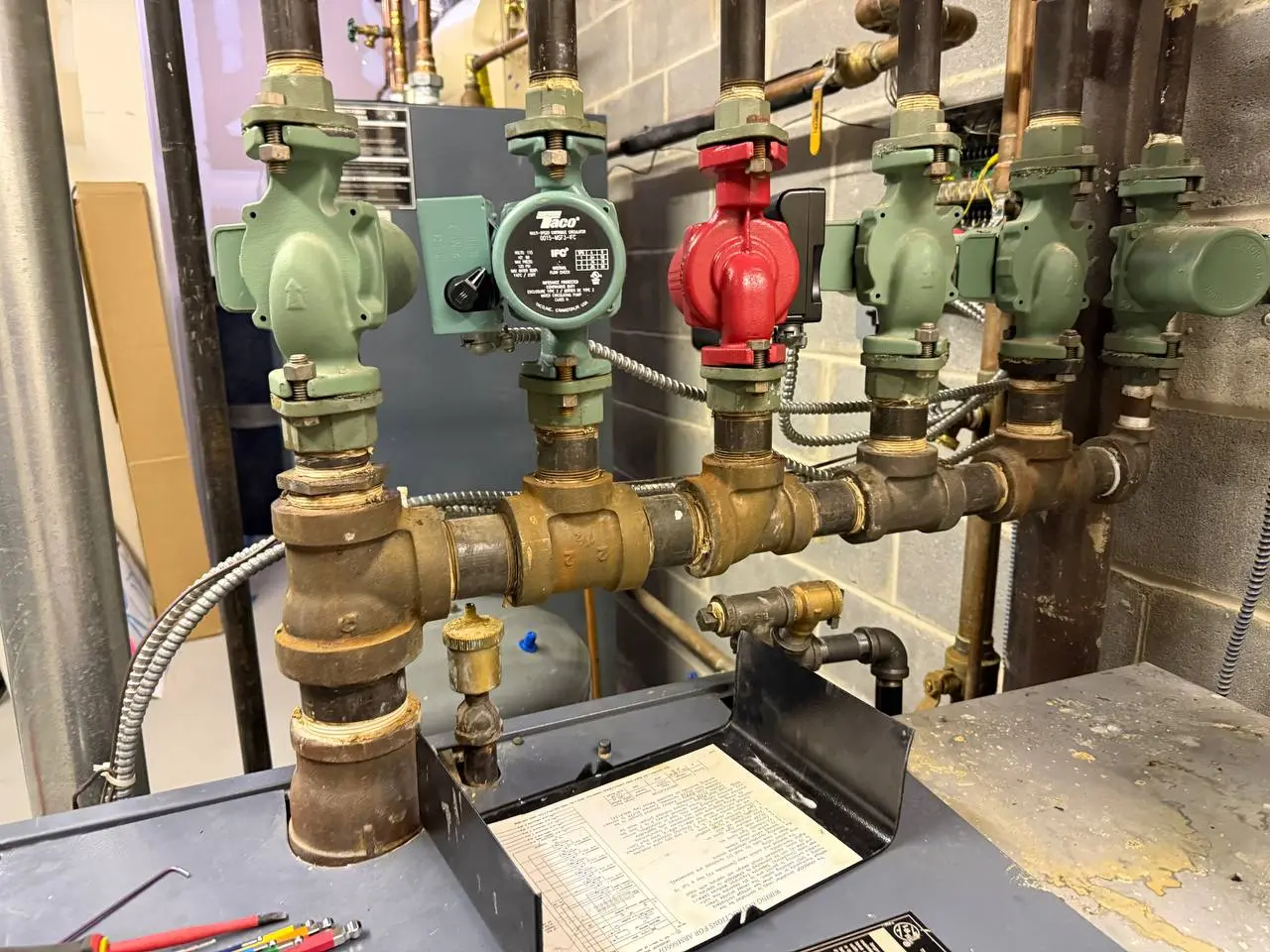 Hydronic heating circulation pump manifold with Taco circulators in Harrison NY boiler room