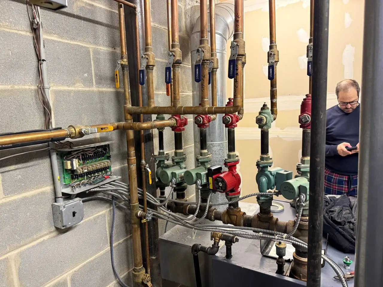 Hydronic heating boiler room piping and multi-zone circulation manifold installation in Harrison NY