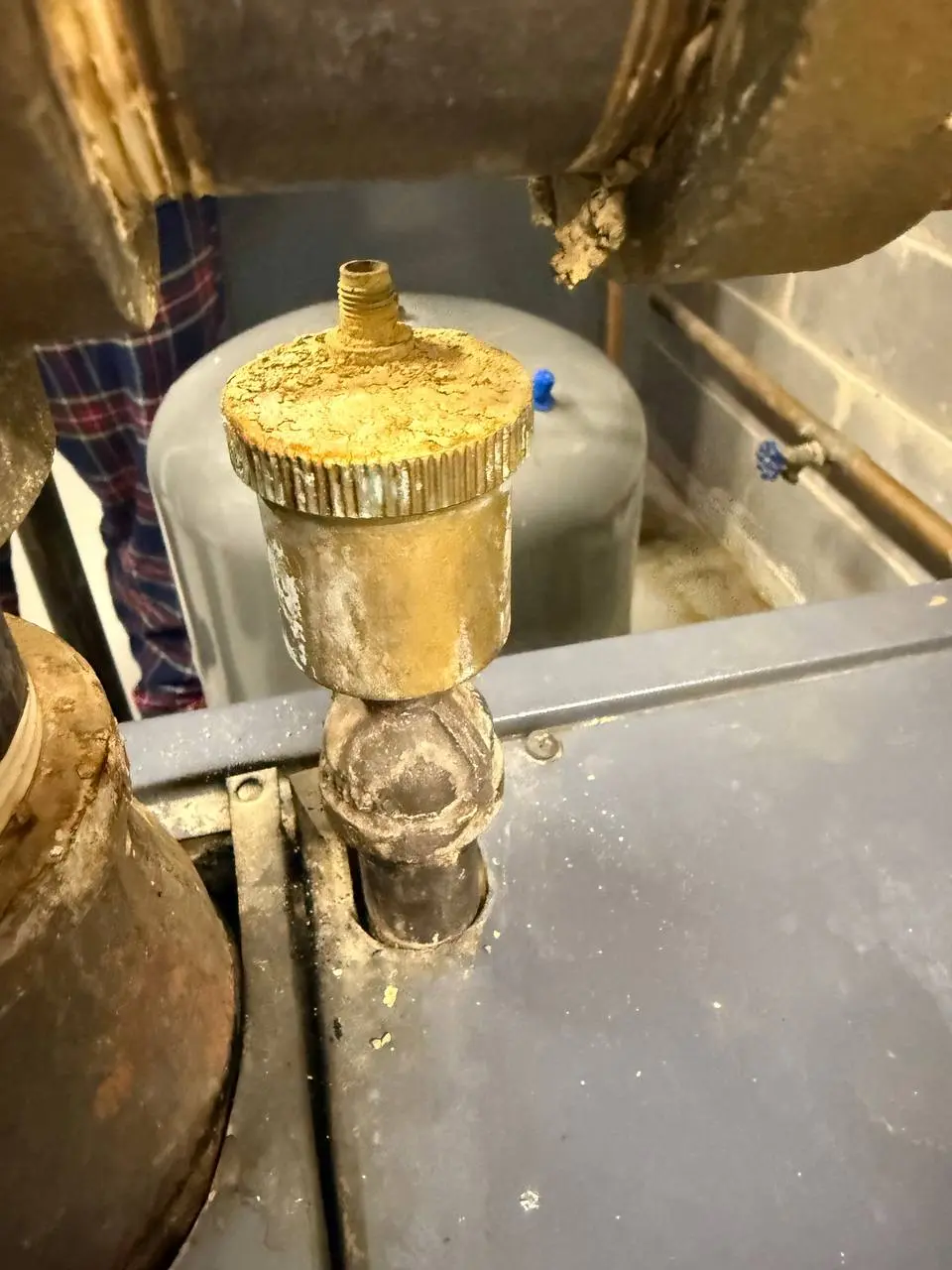 Automatic air removal valve on hydronic heating boiler system close-up in Harrison NY
