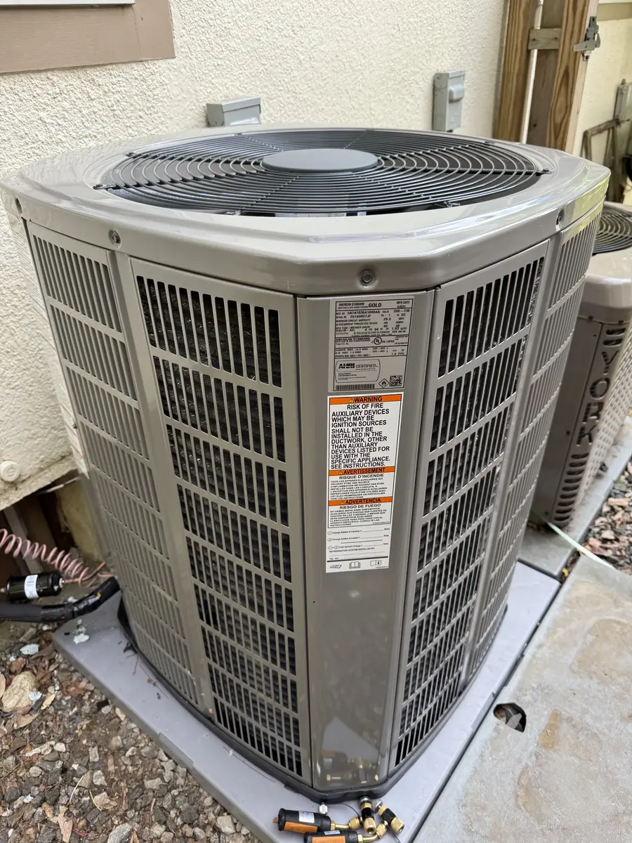 New residential outdoor HVAC condenser installed beside a Hastings-on-Hudson home