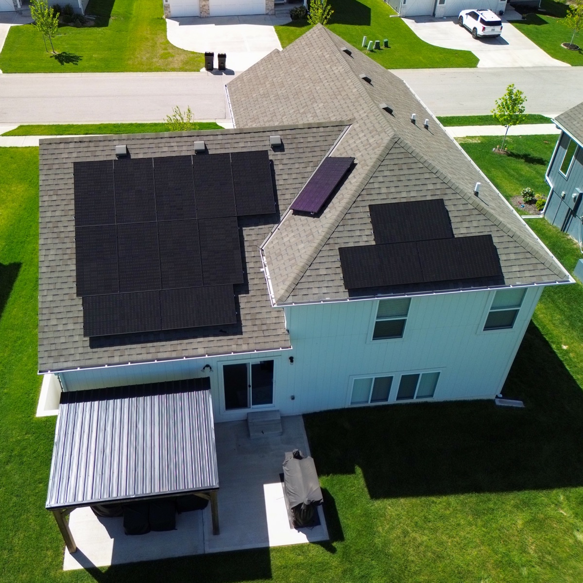 Aerial view of Lifetime Solar residential solar panel system on Midwest home rooftop