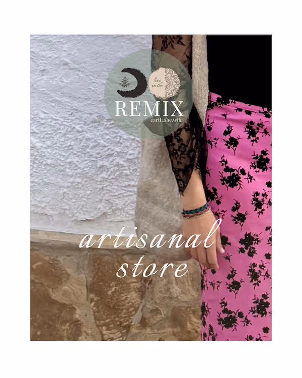 Person wearing a black lace sleeve top and a pink skirt with black floral pattern standing against a textured beige and white wall; text reads 'artisanal store' with a circular logo saying 'REMIX earth.she.wild'.