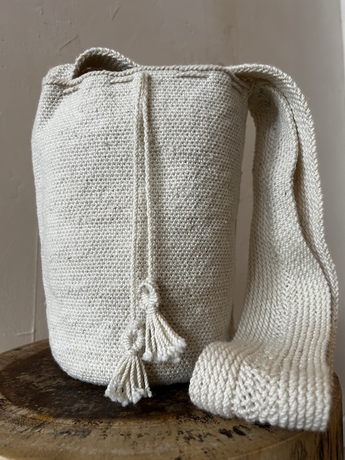 Handwoven by Indigenous women from the Kankuamo Tribe in Sierra de la Nevada de Santa Marta Colombia, each mochila is a unique sacred piece of ancestral art. Crafted with intention and tradition every piece is a unique addition to your conscious wardrobe. Each mochila represents the cosmos, the Mother Earth (Pachamama), and the spiritual world.
The patterns and designs are visual prayers, reflecting the Kankuamo worldview and their relationship with nature and the universe.
The act of weaving is a sacred ritual, traditionally done by women.
The mochila is believed to carry energy, and wearing or carrying one can help maintain spiritual balance.
It is often used to hold sacred items, herbs, or everyday objects with respect for their spiritual function.
The circular shape of the base often represents the cycle of life, the universe, or the womb connecting the mochila to feminine energy and creation. Material: 100% natural fibers, sheep wool from the Sierra de la Nevada
Origin: Sierra Nevada de Santa Marta Please note this is a natural product, to take care with love. Only hand wash No laundry machines or dryers
Any stains can best be treated like wool, clean it with o gall soap and medium warm water. Let it dry horizontally. As you wear it over time the material changes with you, ( like leather) the wool is a dynamic animal fiber. 