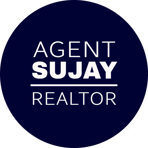 Circular logo with dark blue background displaying the text 'AGENT SUJAY REALTOR' with 'SUJAY' bold and underlined.