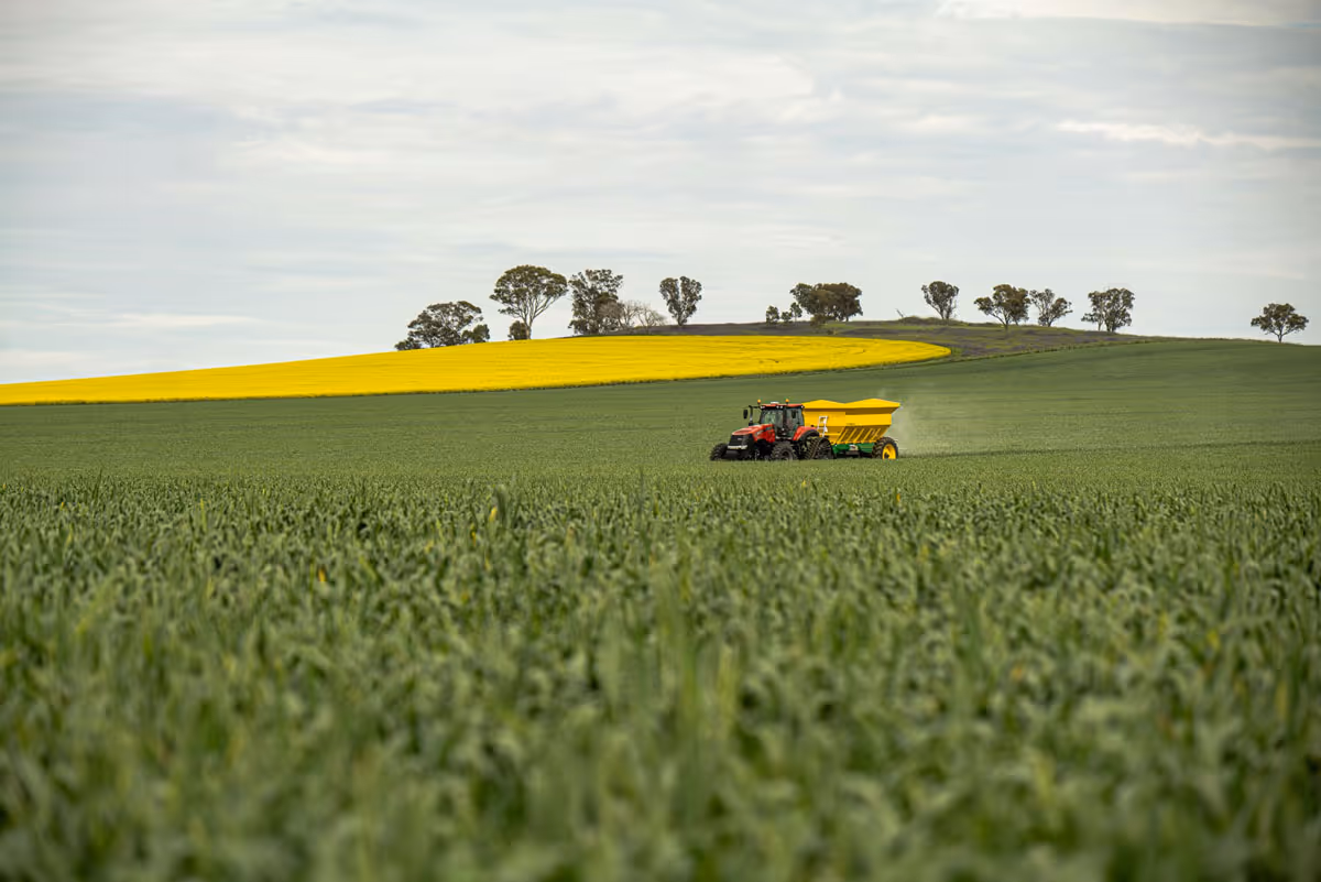 Spreader with tractor in field