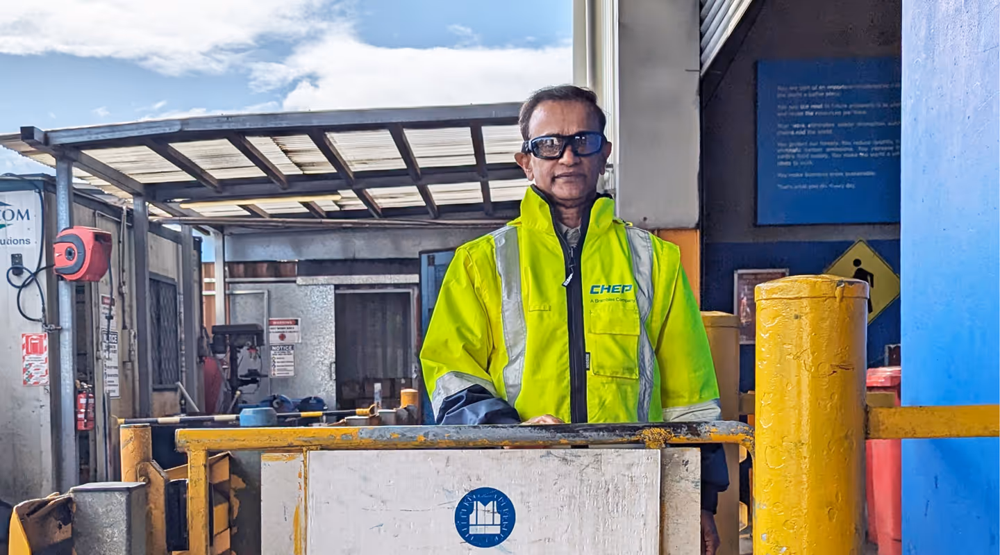 A worker in a high visibility jacket