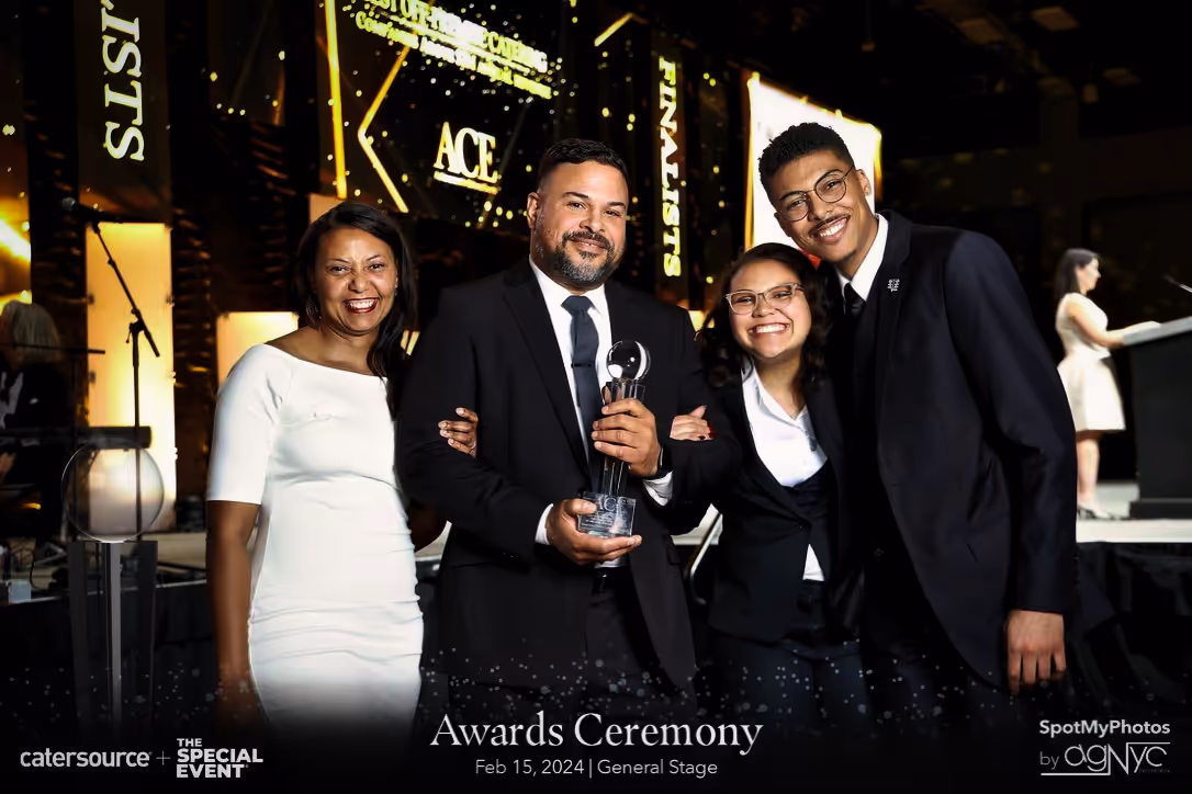 Exquisite Delites founders with family at awards, leaders in luxury catering, Atlanta.