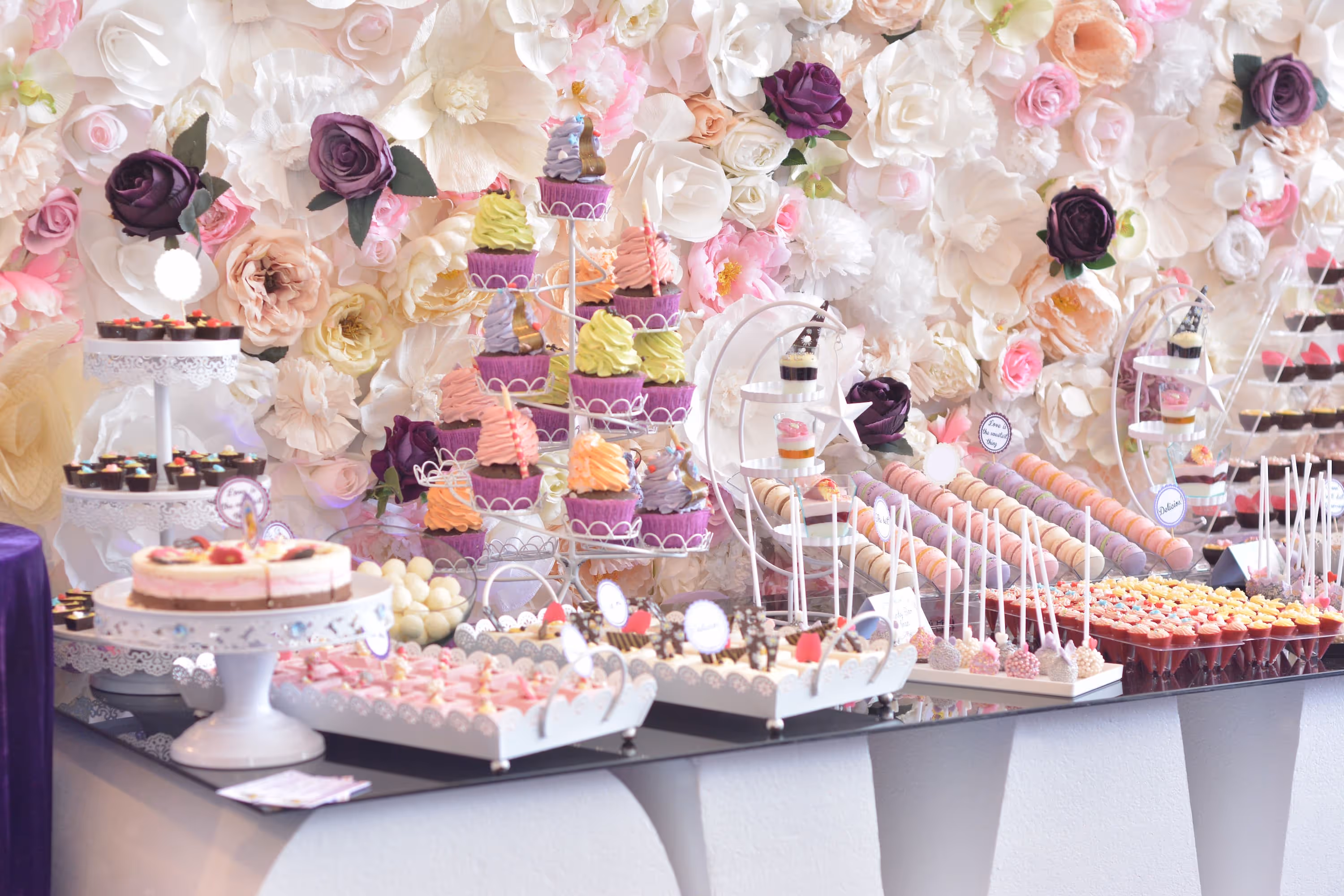 Wedding dessert table with cupcakes and pastries by Exquisite Delites, Atlanta.