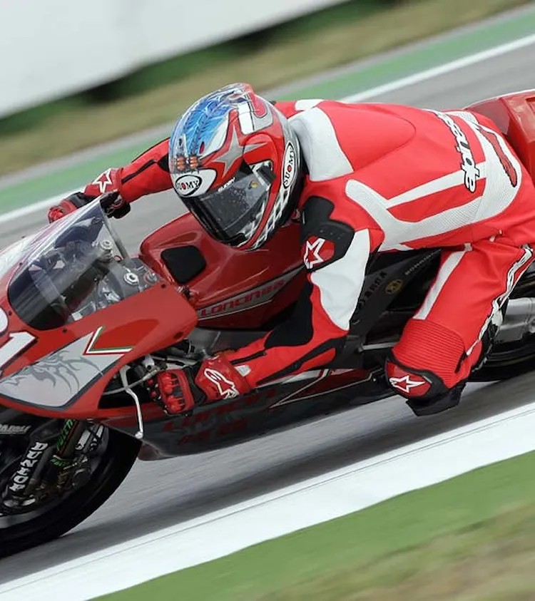 A person riding a motorcycle on a race track.