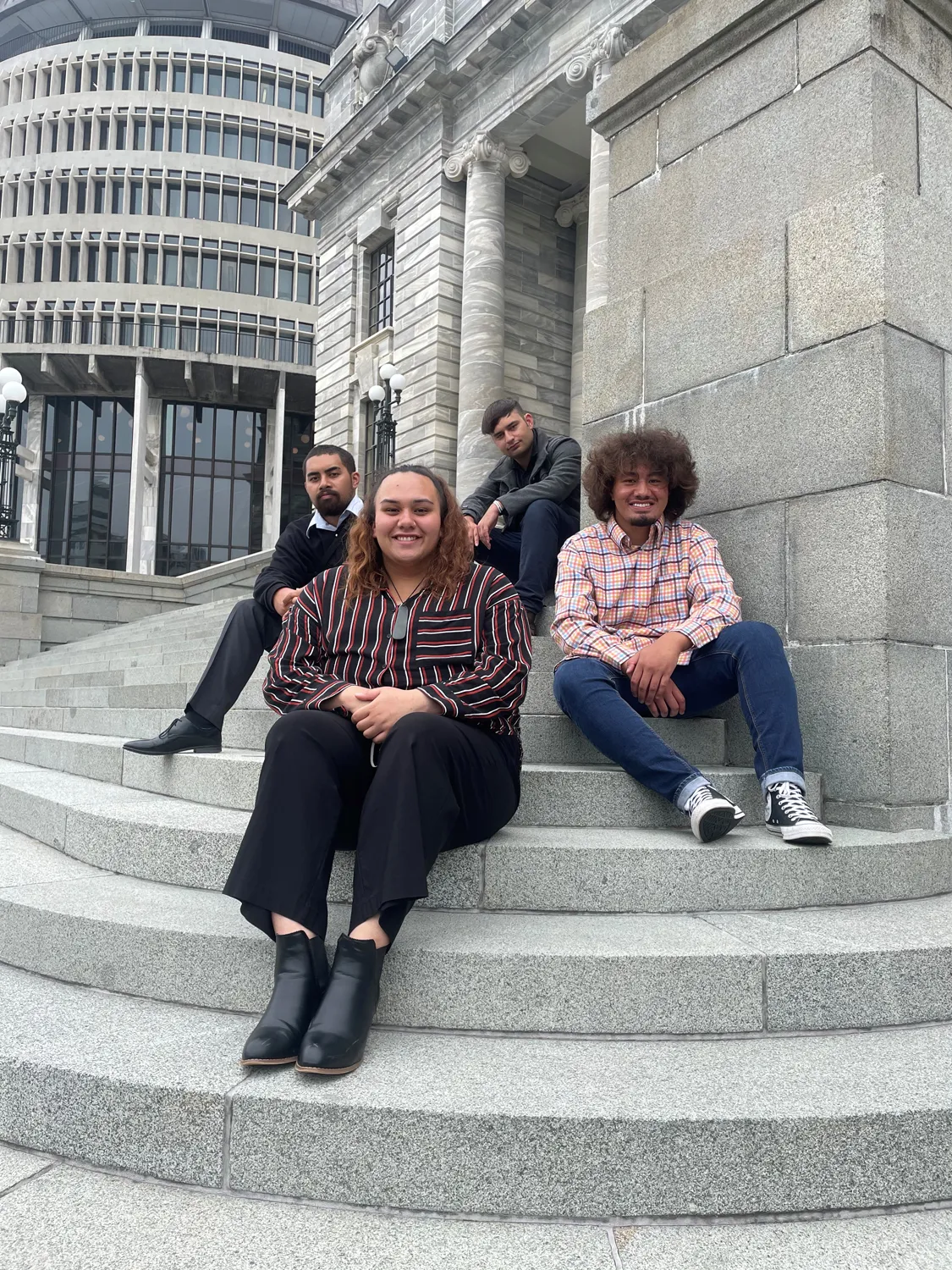 Rise By Talent candidates sitting on a step in New Zealand