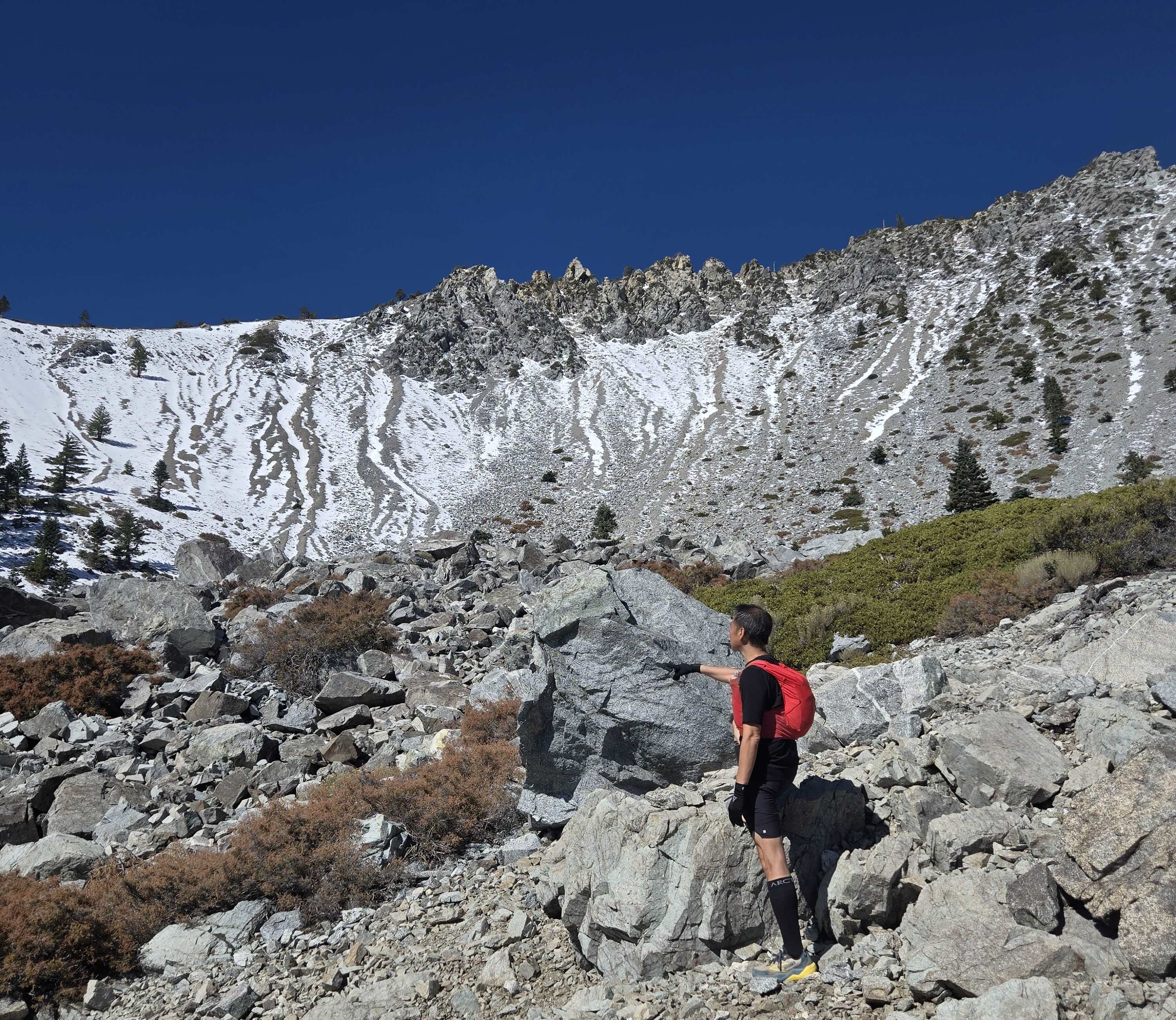 Hiker ascending in early light, symbolizing metabolic awakening through fasted movement