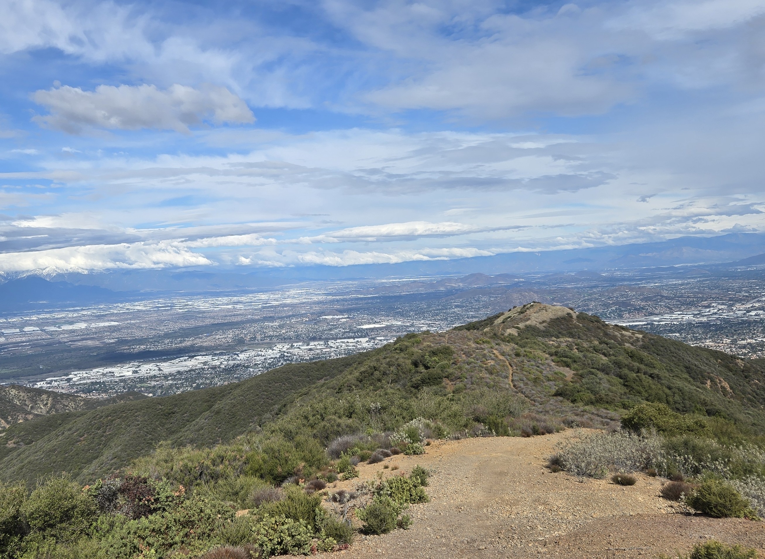 View of Mount Baldy snowcaps from Skinsuit trail in Corona, CA