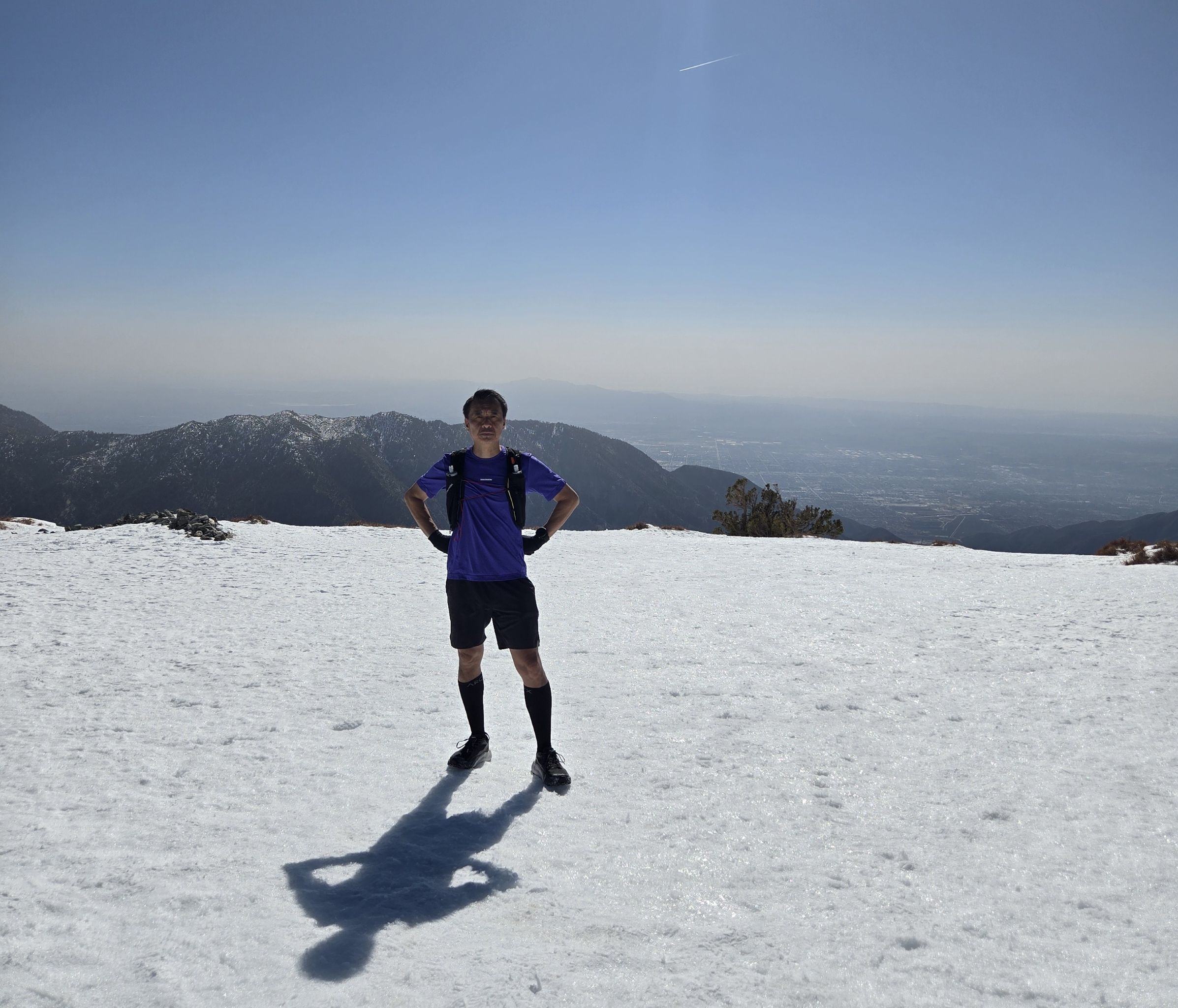 TrailGenic founder standing on a snow-covered mountain plateau at altitude, documenting real-world physiological stress during a fasted hike.