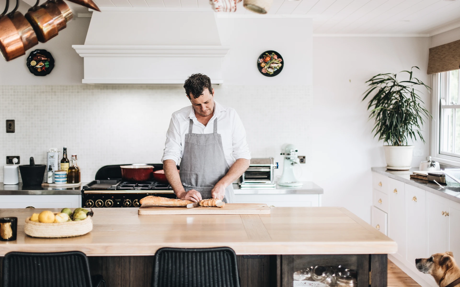 Chef Alex Watts preparing food for a private dining meal