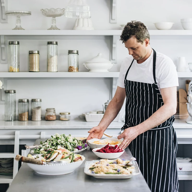 Chef Alex Watts preparing food for a private dining experience
