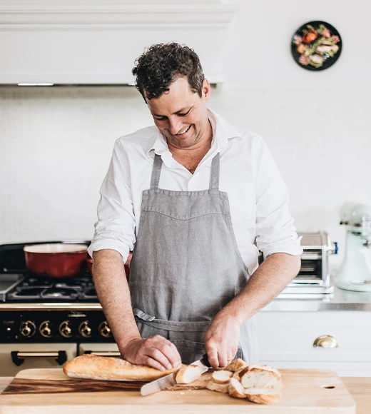 Alex Watts private chef cutting bread