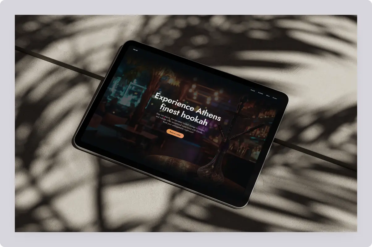 A tablet showing a cocktail bar website