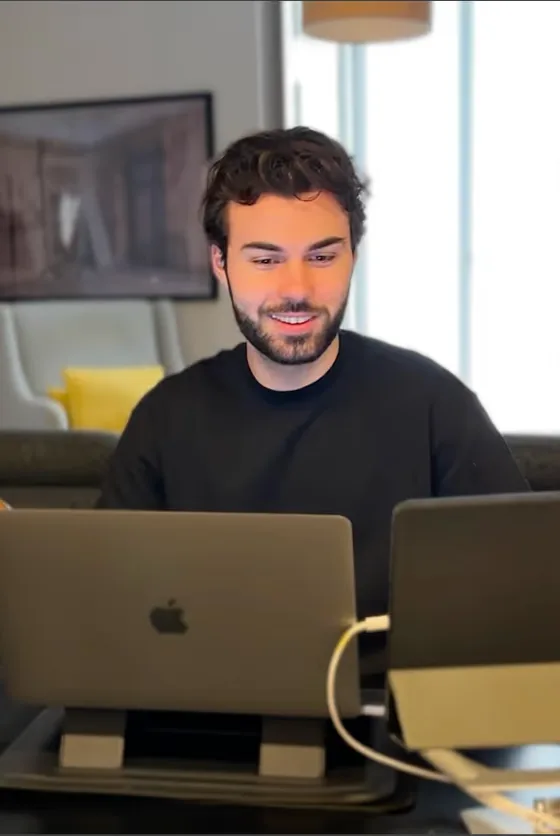 A Noqode team member working on a laptop