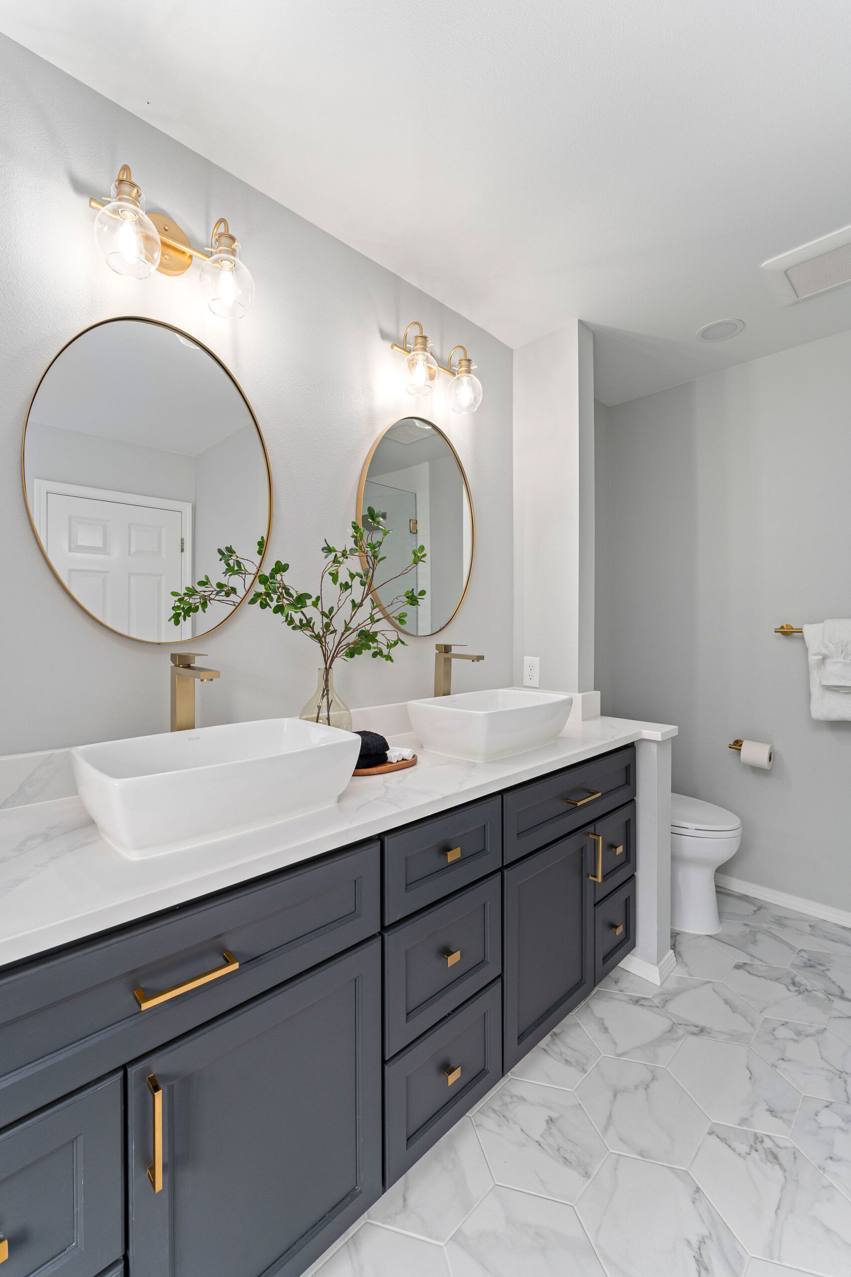 Elegant bathroom with a dual-sink vanity featuring matte black