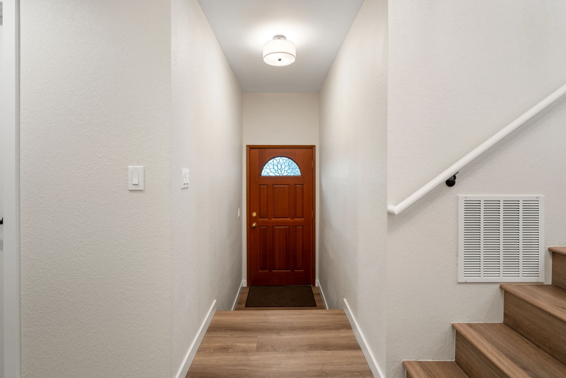 Refreshed interior door painted light tone after Bellevue home renovation
