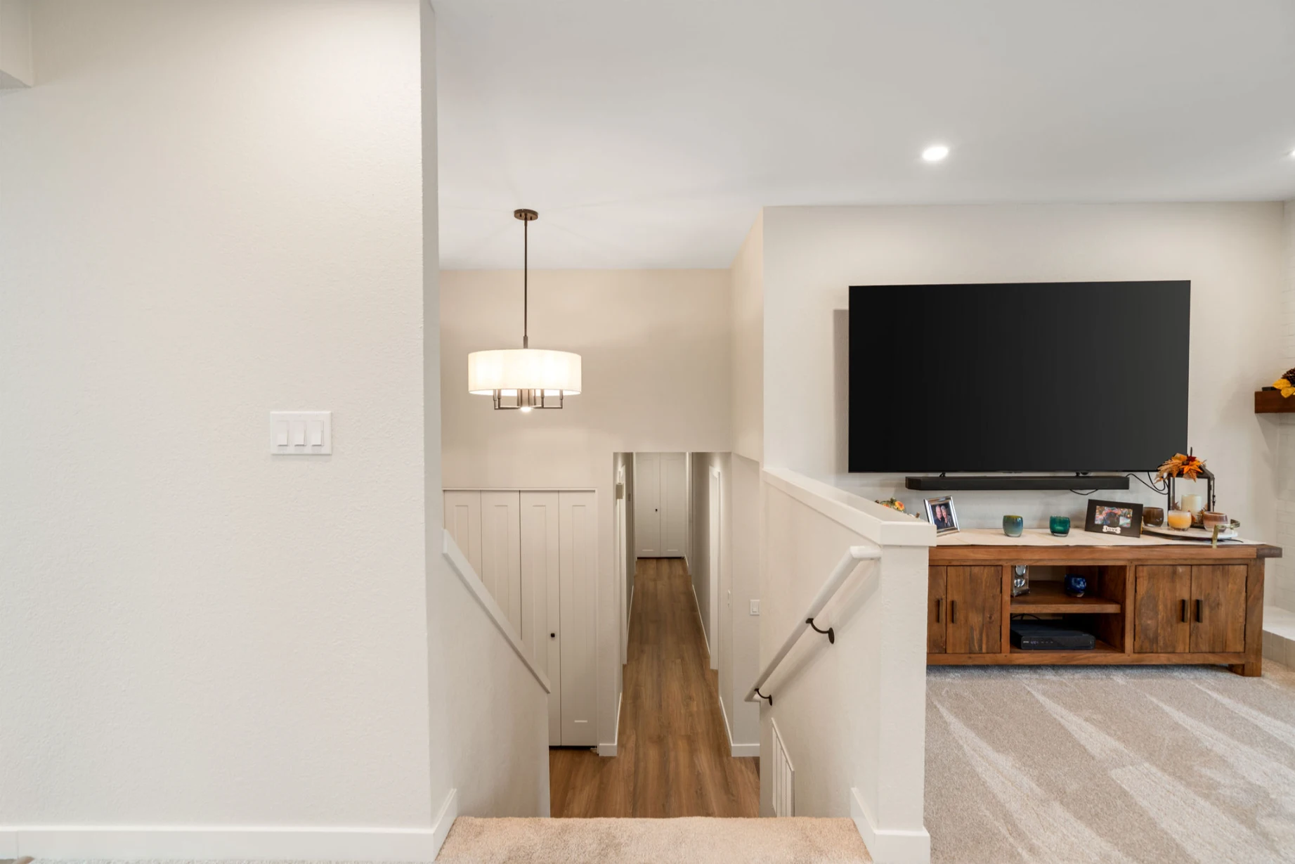 After remodel of Bellevue home staircase with updated finishes and brighter appearance