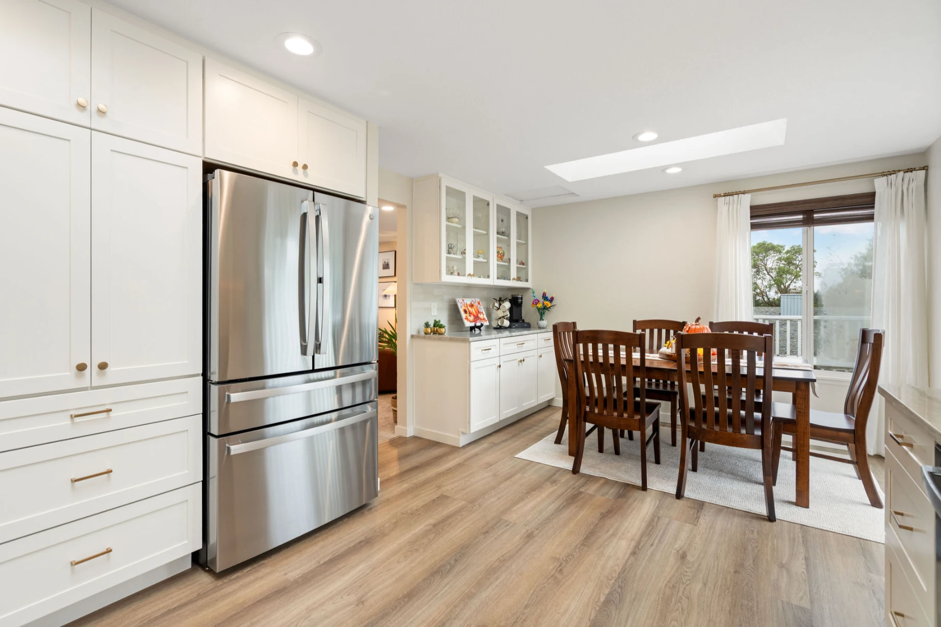 Bright modern Bellevue kitchen after full gut remodel with added storage and stone surfaces