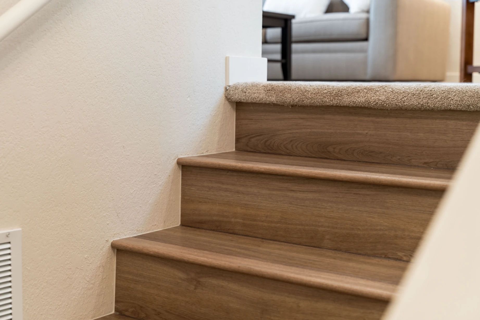Brightened staircase after remodel in Bellevue home with refreshed steps and clean lines