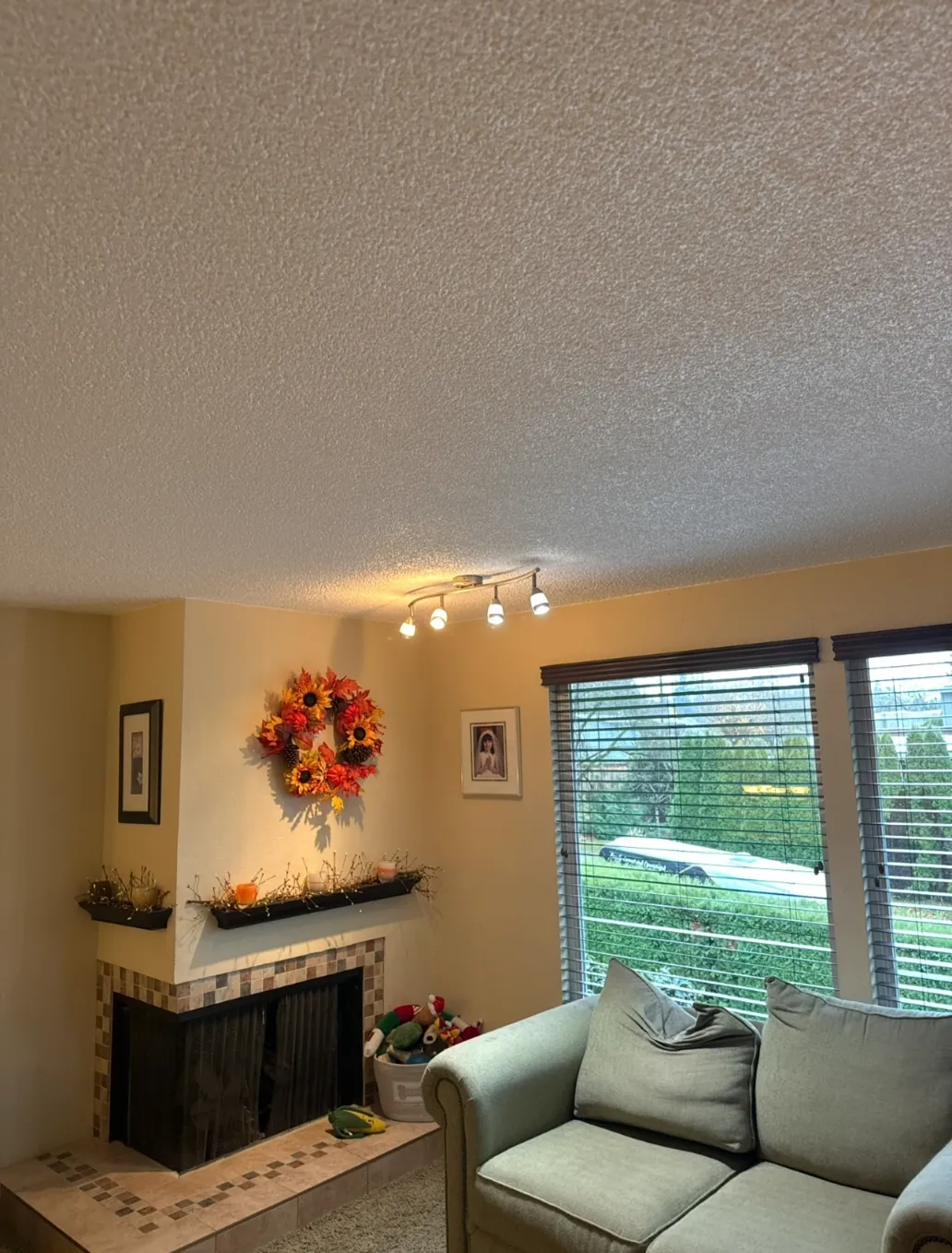 Outdated Bellevue home interior before renovation with dark finishes and limited natural light