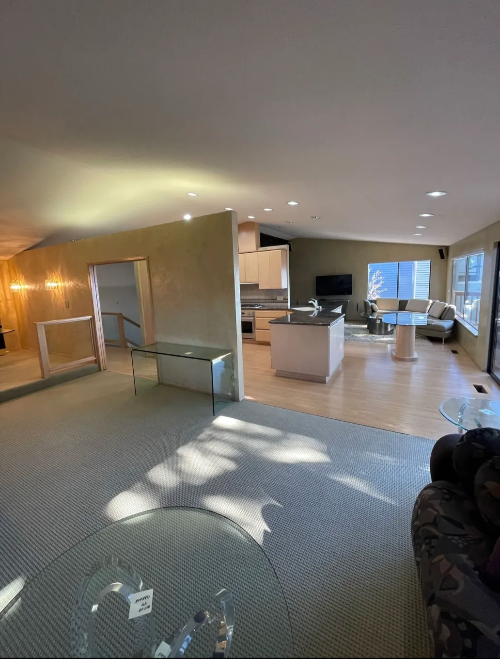 Outdated Bellevue home interior before renovation with dark finishes and limited natural light