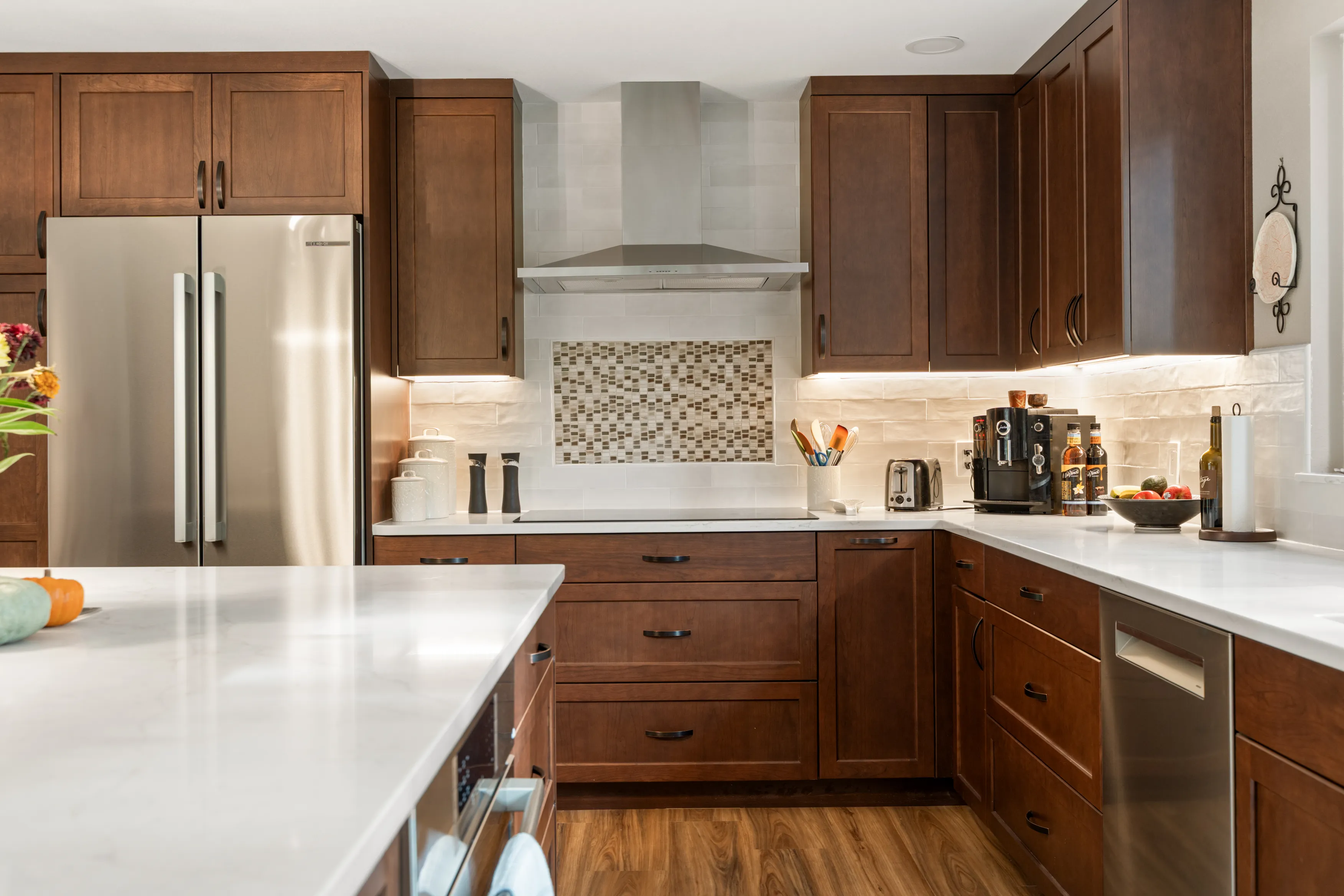 Bright open kitchen in Bellevue home after remodel with island and modern lighting