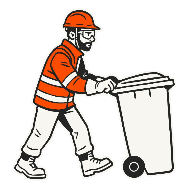 A WasteCo team member pushing a wheelie bin