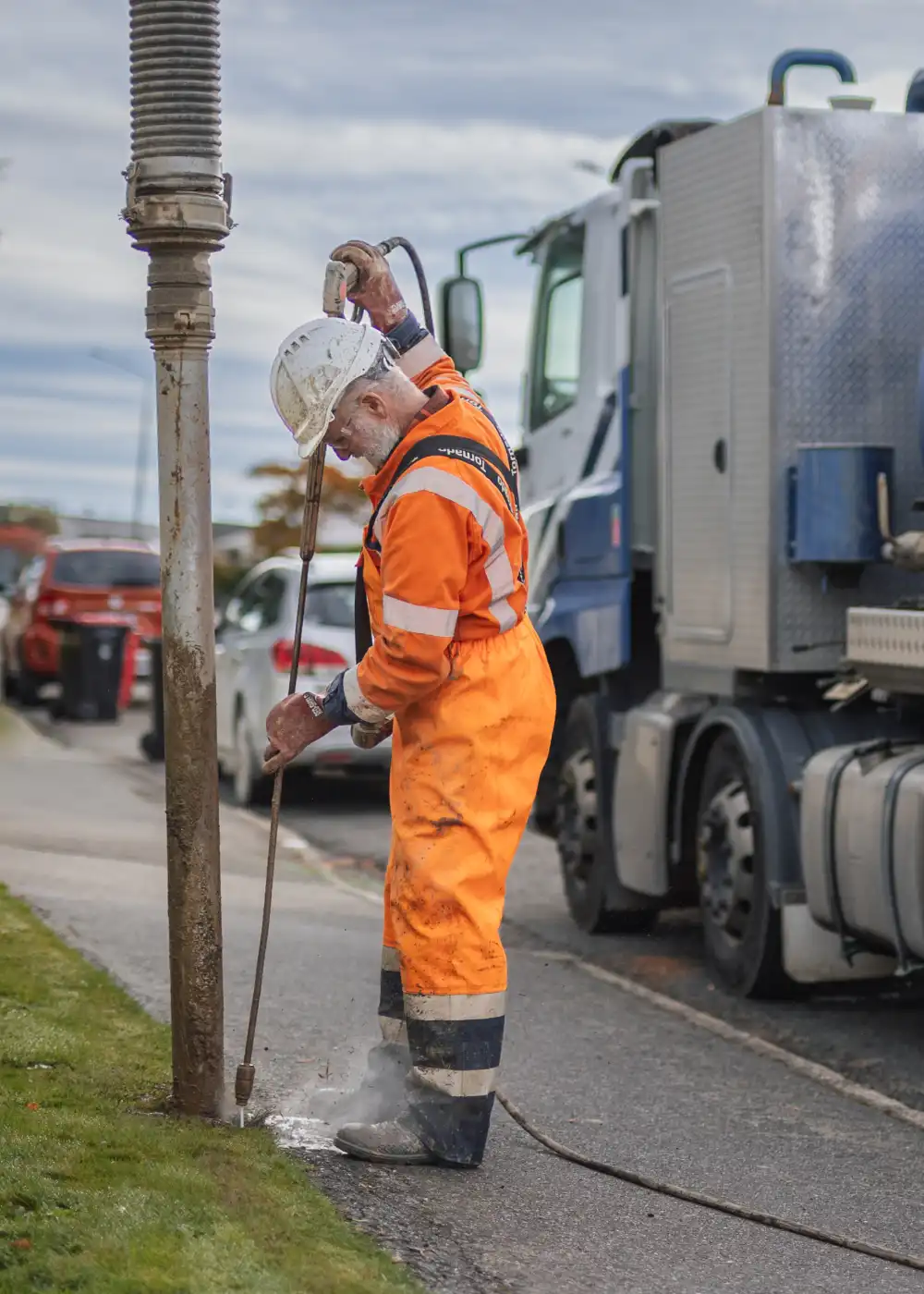 WasteCo team member operating a Hydrovac excavation system