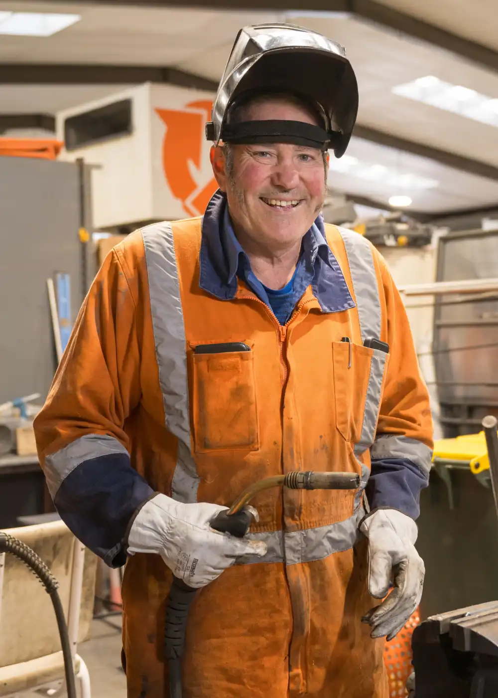 A WasteCo team member working in the automotive shop