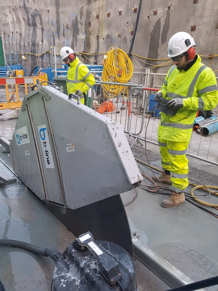 Operative using a concrete saw to cut a slab