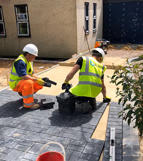 Operatives working on construction site