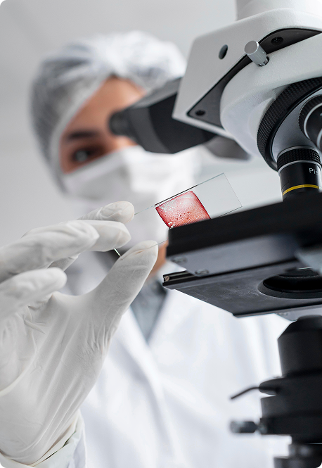 Close-up of a scientist looking at a blood-sample