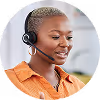 Woman with headset smiling while working in customer support